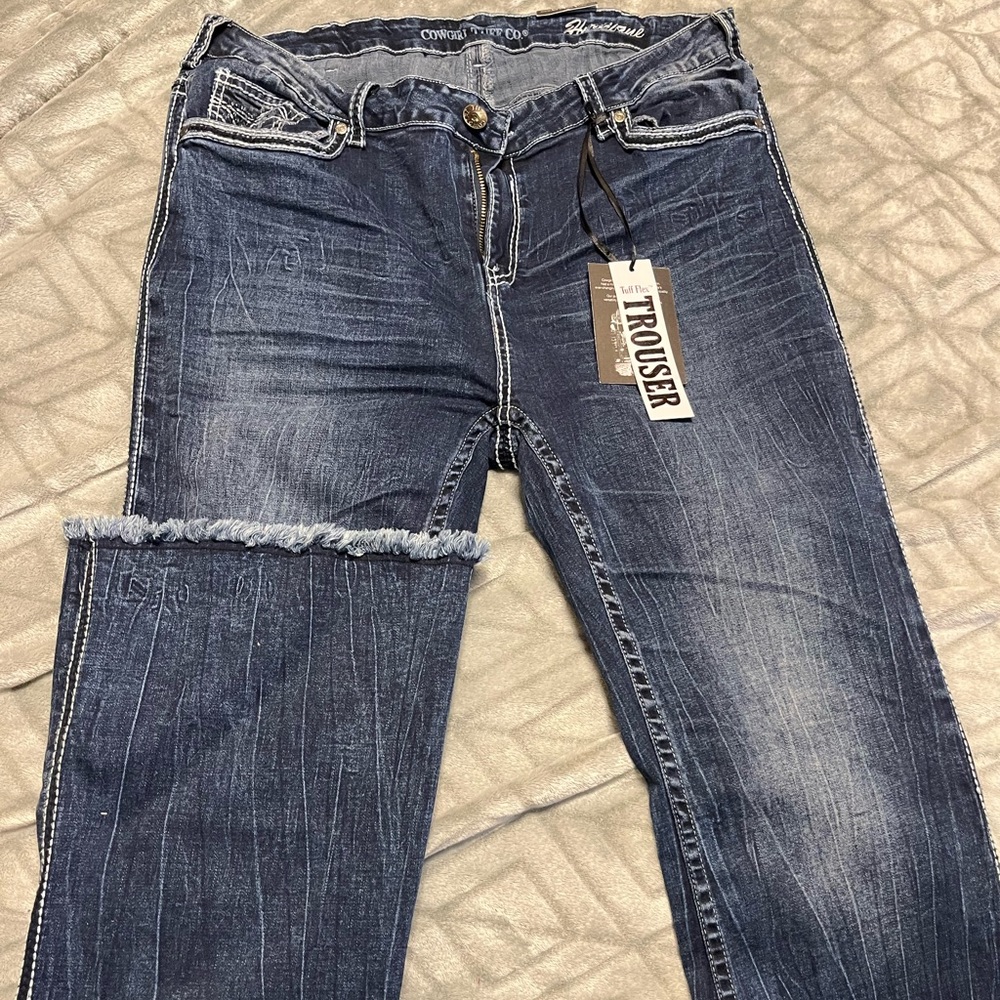 Brand new paid of Cowgirl Tuff trouser hurricane jeans! Size 38 regular.